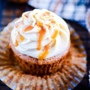 Simple apple cider cupcakes with homemade salted caramel frosting on top.