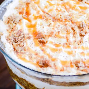 Layers of carrot cake, caramel sauce, and a cheesecake filling make this Carrot Cake Cheesecake Trifle unbeatable!