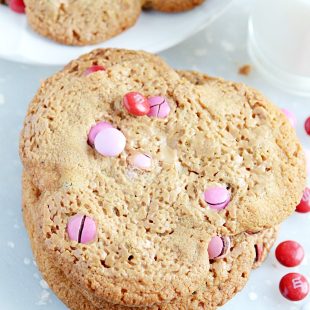 This is a recipe from my local bakery and it is SO good! Peanut butter smeared on top of chocolate chip cookie dough and topped with M&Ms. EASY too :)