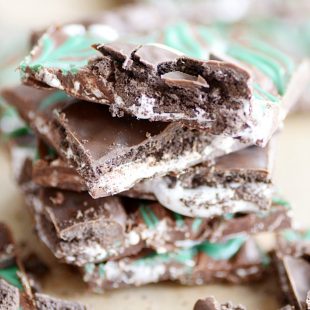 Easy chocolate bark filled with marshmallow cream swirls and Thin Mint cookies.