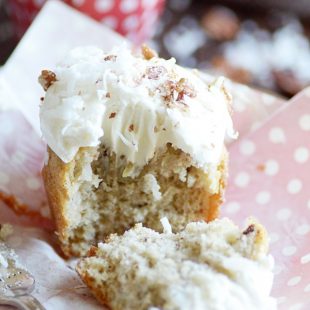 This Southern classic is banana bread and cupcake all rolled into one! A super moist banana cupcake with crushed pineapple, coconut, and pecans folded into the batter topped with an irresistibly dreamy cream cheese frosting.