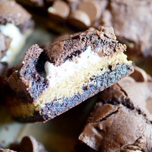 Chewy, fudgy brownie cookie bars with a marshmallow swirl, and graham cracker crust layer, and semi-sweet chocolate chips.