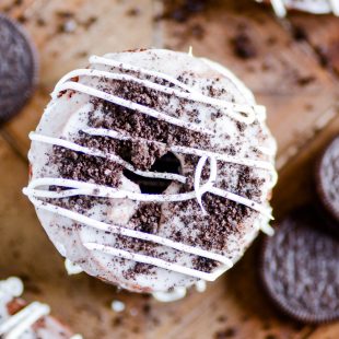 Moist chocolate donuts that are baked instead of fried, topped with a sweet glaze and Oreo crumbles.
