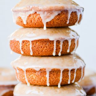 These Baked Whole Grain Donuts have a rich, nutty flavor with a hearty texture that stays soft and delicious. Add a simple maple glaze to take these to another level!