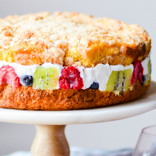 This gorgeous coffee cake is soft and moist, easy-to-make, and has a delicious layer of cheesecake and fruit in the middle!