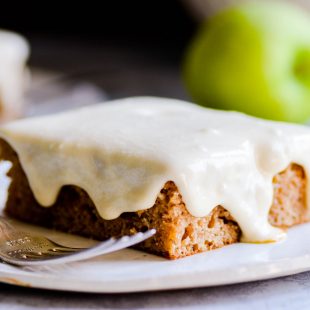 Delicious apple spice sheet cake soaked in caramel sauce and topped with caramel icing.